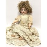 A late 19thc Simon & Halbig German bisque head doll with flirty eyes and open mouth, with