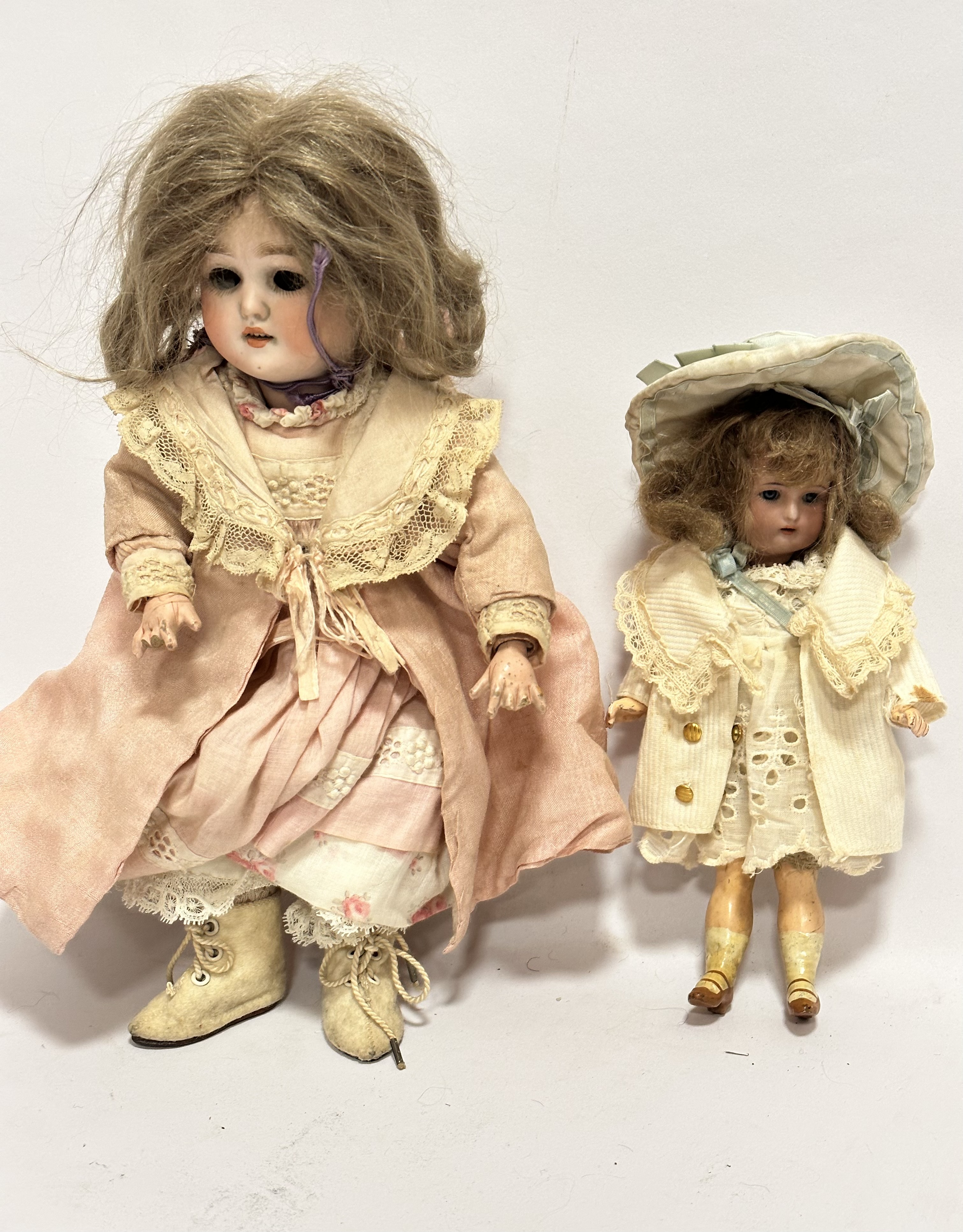 A late 19thc Simon & Halbig German bisque head doll with natural hair, 58007710, with jointed