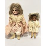 A late 19thc Simon & Halbig German bisque head doll with natural hair, 58007710, with jointed
