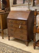 An Edwardian inlaid and satinwood banded mahogany bureau, the fall front enclosing fitted