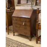 An Edwardian inlaid and satinwood banded mahogany bureau, the fall front enclosing fitted