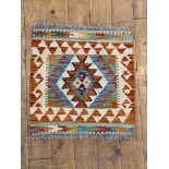 A Chobi kilim vegetable died rug, of geometric design, 53cm x 51cm