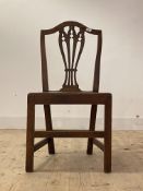 A George III elm Hepplewhite style country chair, circa 1800, the shaped crest rail over pierced