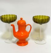 A pair of mid century ribbed green glass stemmed dishes on circular spreading foot, (24cm x 15cm)