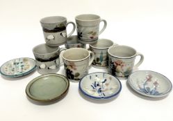 Six various Highland stoneware mugs, four with flowering and leaf design and two with Blackface
