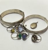 Five various white metal and silver rings, one set oval cabuchon green stone, another with