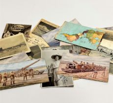 A collection of vintage postcards of various themes including WWI, views of Japan, portrait,