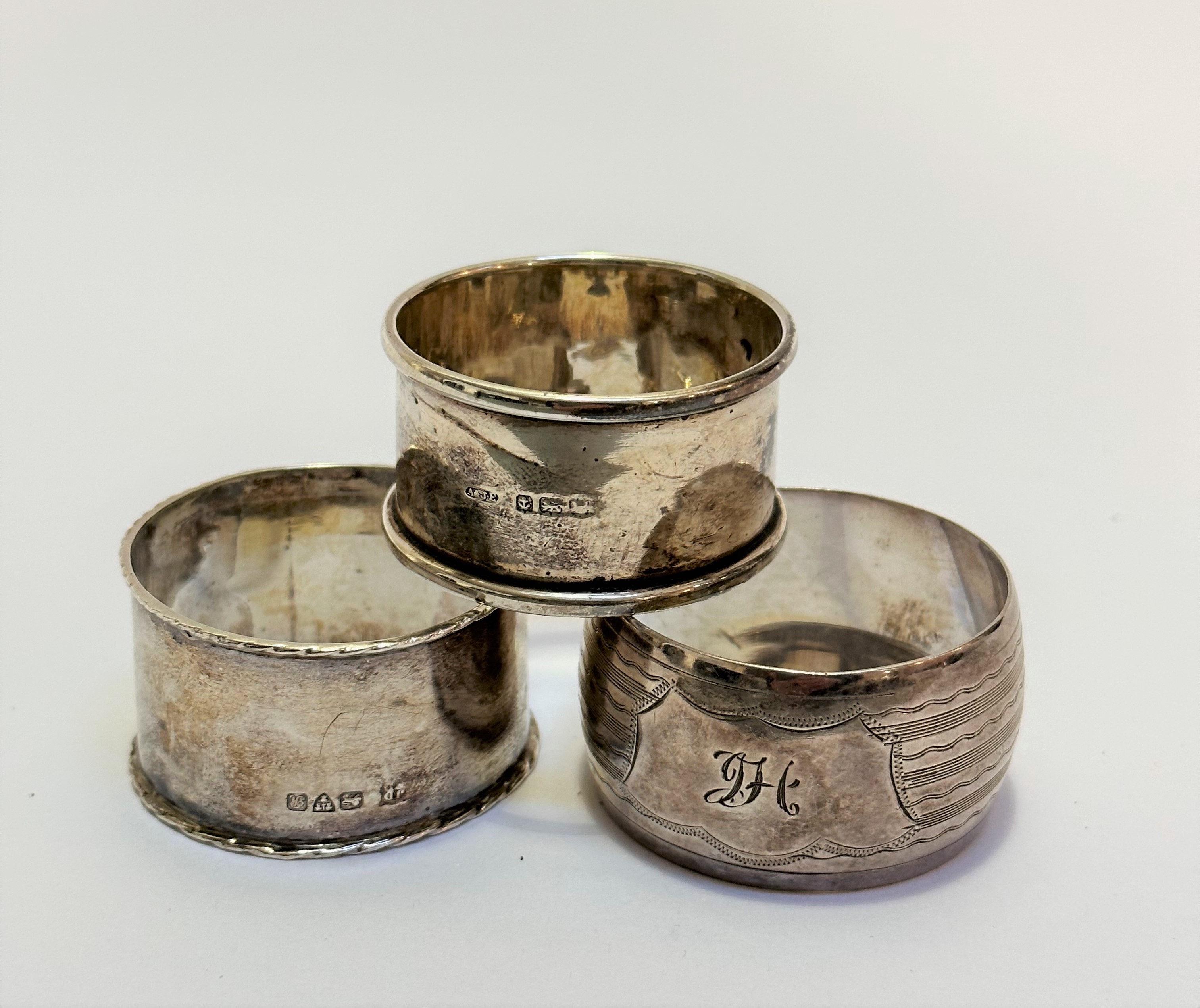 A Birmingham silver napkin ring and a Birmingham silver engraved napkin ring with engraved