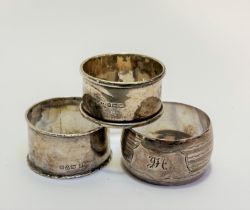 A Birmingham silver napkin ring and a Birmingham silver engraved napkin ring with engraved