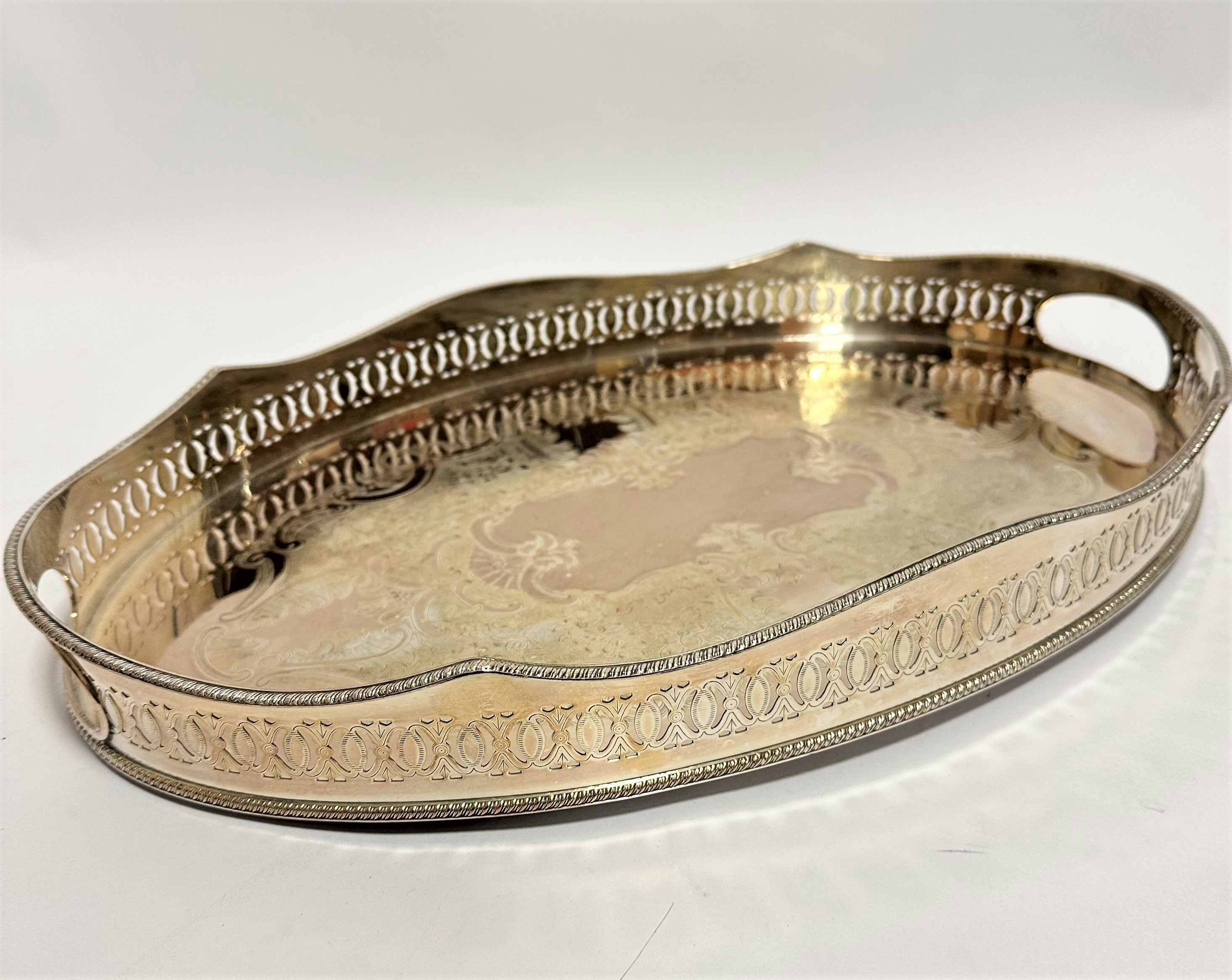 A Sheffield plated oval engraved gallery two handled tea tray with gadroon border (6cm x 46 x 29cm)