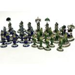 An Indian white metal enamelled set of chess figures including some on camels, elephants, horses etc