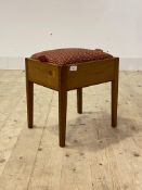 A Vintage varnished pine stool, the upholstered seat enclosing storage well, H40cm, W38cm, D30cm