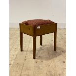 A Vintage varnished pine stool, the upholstered seat enclosing storage well, H40cm, W38cm, D30cm