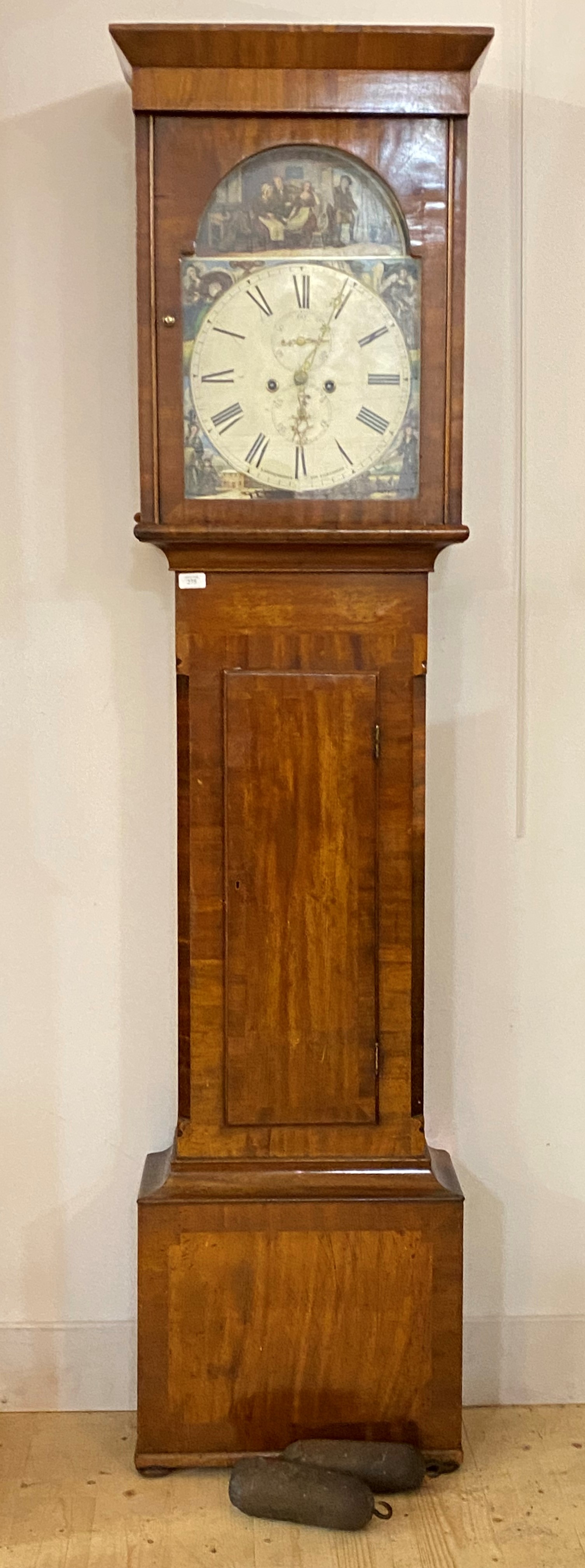 An early 19th century mahogany longcase clock, the white painted dial with Roman chapter ring, sub
