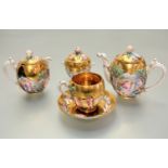 A Naples early 20thc four piece morning tea service including teapot, covered sucrier and milk