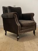 A Modern grey crushed velvet upholstered easy chair, with studded detail, squab cushions, raised