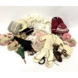 A collection of dolls clothing and accessories including two Edwardian parasols, one with lace