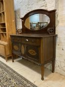 An Edwardian inlaid mahogany mirror back sideboard, with two drawers and two cupboards raised on