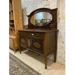 An Edwardian inlaid mahogany mirror back sideboard, with two drawers and two cupboards raised on