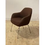 A Mid century tub chair, upholstered and raised on chrome supports, H82cm, W64cm