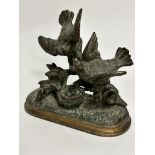 A French cast bronze bird figure group with nest of chicks, unsigned, mounted on gilt metal base,