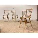 A Set of four light beech and plywood Ercol style comb back dining chairs, H81cm, W38cm, D36cm