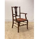 An Edwardian mahogany side chair, with upholstered seat, raised on square tapered supports united by