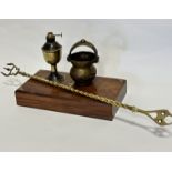 A miniature brass handled dish, a miniature brass oil lamp base, a brass toasting fork and a brass