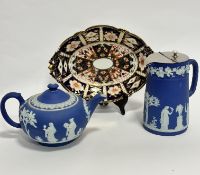 A Wedgwood Royal blue Jasperware teapot of squat form (13cm x 22cm), a similar decorated hot water