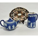 A Wedgwood Royal blue Jasperware teapot of squat form (13cm x 22cm), a similar decorated hot water