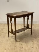 An Arts and Crafts period oak side table, the moulded top over pierced panel ends and square tapered