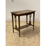 An Arts and Crafts period oak side table, the moulded top over pierced panel ends and square tapered