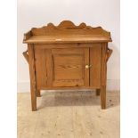 A pitch pine bathroom cabinet, first half of the 20th centruy, the shaped raised back over