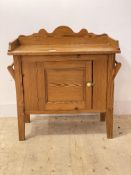 A pitch pine bathroom cabinet, first half of the 20th centruy, the shaped raised back over