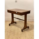 A Victorian mahogany library table, the rectangular top fitted with a drawer, raised on panel end