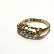 An 18ct gold five stone old mixed cut diamond ring mounted in channel setting, size K, weighs 2.5g