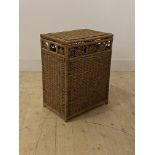 A Wicker lidded laundry basket, H59cm, W46cm, D31cm