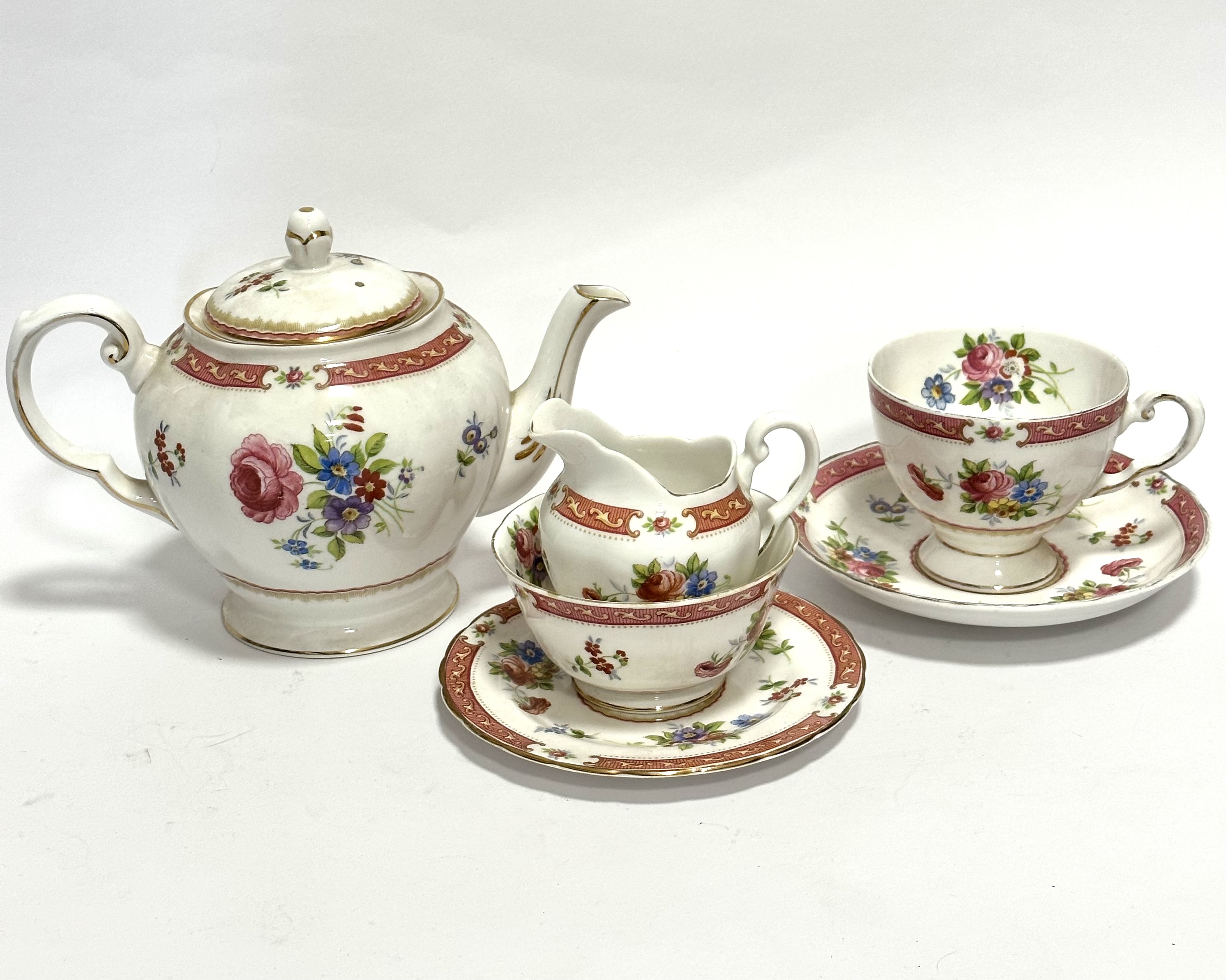 A Tuscan china Lowestoft morning tea set for one including teacup, saucer, milk jug, sugar basin,