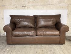 A modern sofa bed, upholstered in quality brown leather, H90cm, W200cm, D100cm