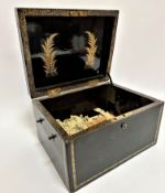 A Victorian lacquered box, the hinged top with gilt cipher FWC the inside top with fern gilt
