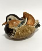 An Audrey Carter pottery handmade teal duck, signed verso, (13cm x 19cm x 11cm), one crest to head