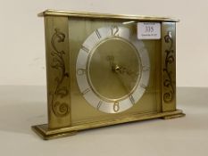 A mid 20th century brass mantel clock with quartz movement, H14cm