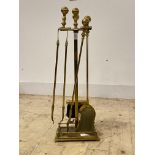 A Brass four piece fireside companion set, H74cm