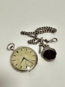 An Art Deco Continental white metal open faced pocket watch with silvered stylised engine turned