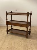 A Victorian mahogany three tier what not, fitted with a drawer, on turned supports, H104cm,