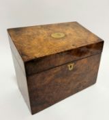 An Edwardian burr walnut slope-front stationary box, the hinged top enclosing a fitted interior with