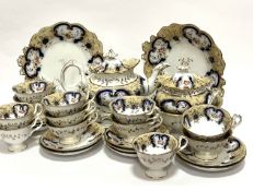 A Victorian china twenty eight piece tea and coffee service, including two cake plates, a bread