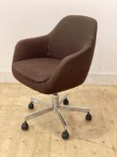 A mid century tub office chair, upholstered and swivelling on a chrome five point base with castors,