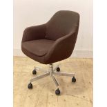 A mid century tub office chair, upholstered and swivelling on a chrome five point base with castors,