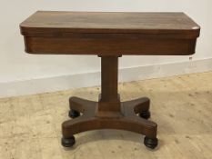 A mid 19th century rosewood card table, the fold over revolving top enclosing a baize lined